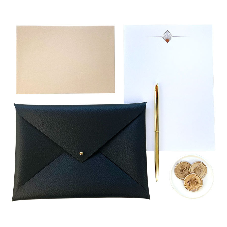 An elegant Art Deco writing set, presented in a handmade faux-leather envelope pouch.