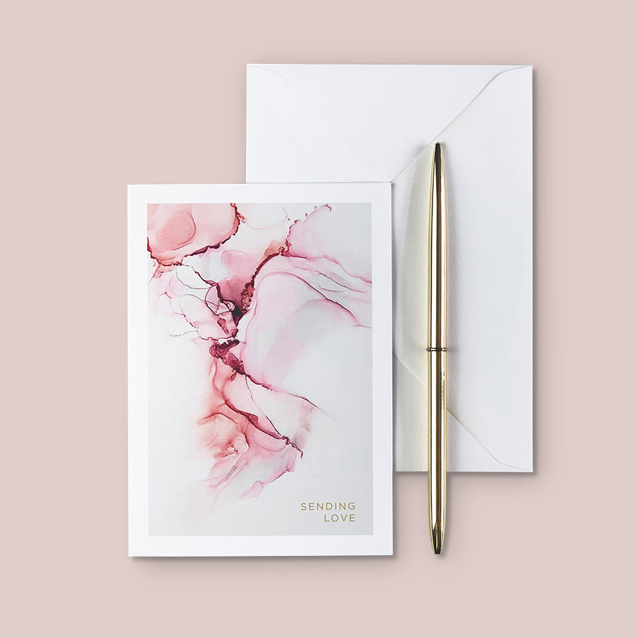 A delicate abstract A6 greeting card featuring the design of one of our original alcohol ink prints from 'The Ethereal Collection' in shades of pink & peach