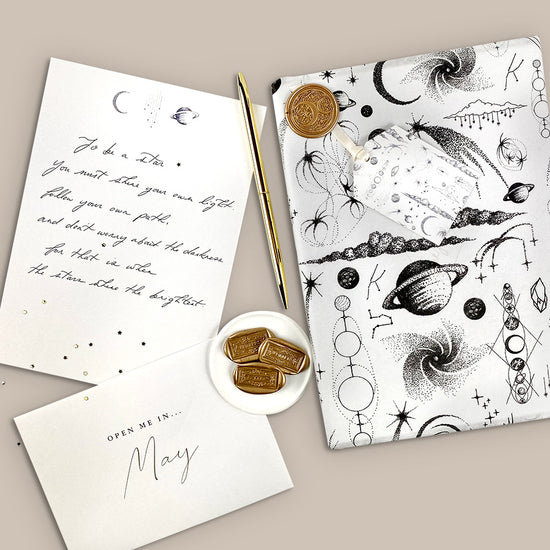 Year of letters box, a unique keepsake gift with luxury writing paper, envelopes, & gold foil stickers for you to write 12 letters.