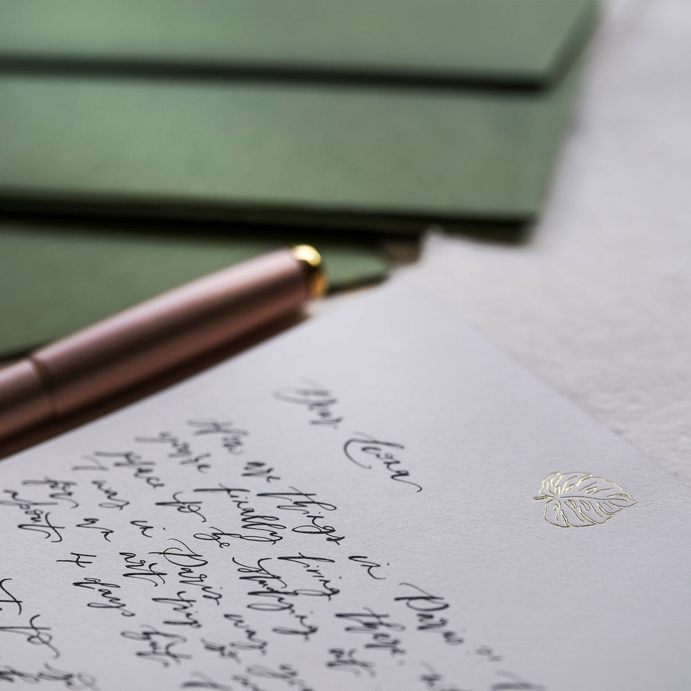 
                      
                        A perfect blend of luxury and tradition, this gold foiled letter writing set with a monstera leaf design is the ideal gift for those who appreciate the art of thoughtful communication.
                      
                    