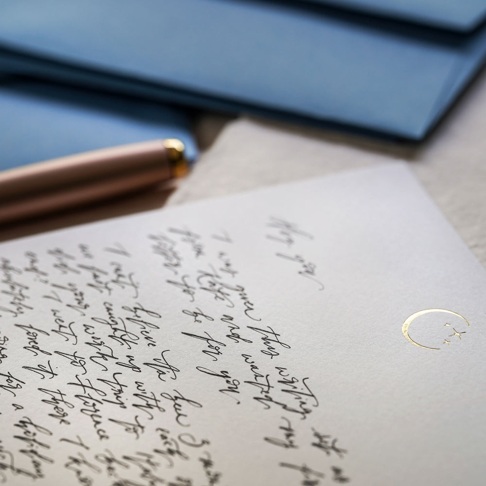 Rediscover the joy of handwritten correspondence with our luxury letter writing set with a delicate gold moon & star design.