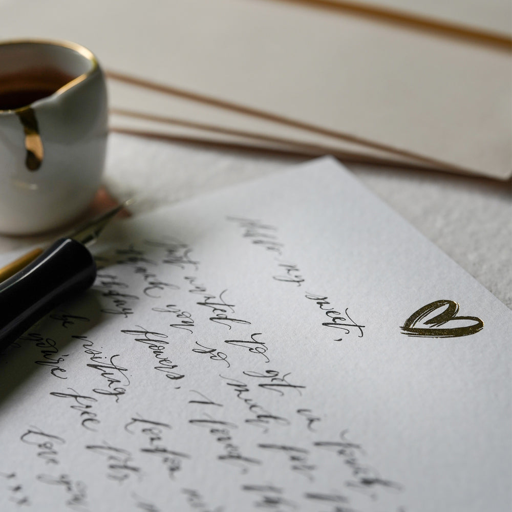 
                      
                        Show some love with our hand foil pressed gold heart notecards, designed to delight the writer & the receiver.
                      
                    