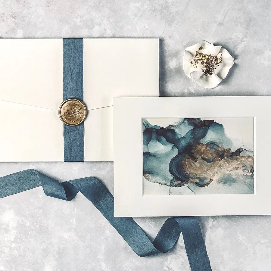 Load image into Gallery viewer, Elegant alcohol ink A6 print taken from our original painting featuring a delicate blue &amp;amp; gold design. Blue &amp;amp; Gold Alcohol Ink A6 Mounted Art Print.
