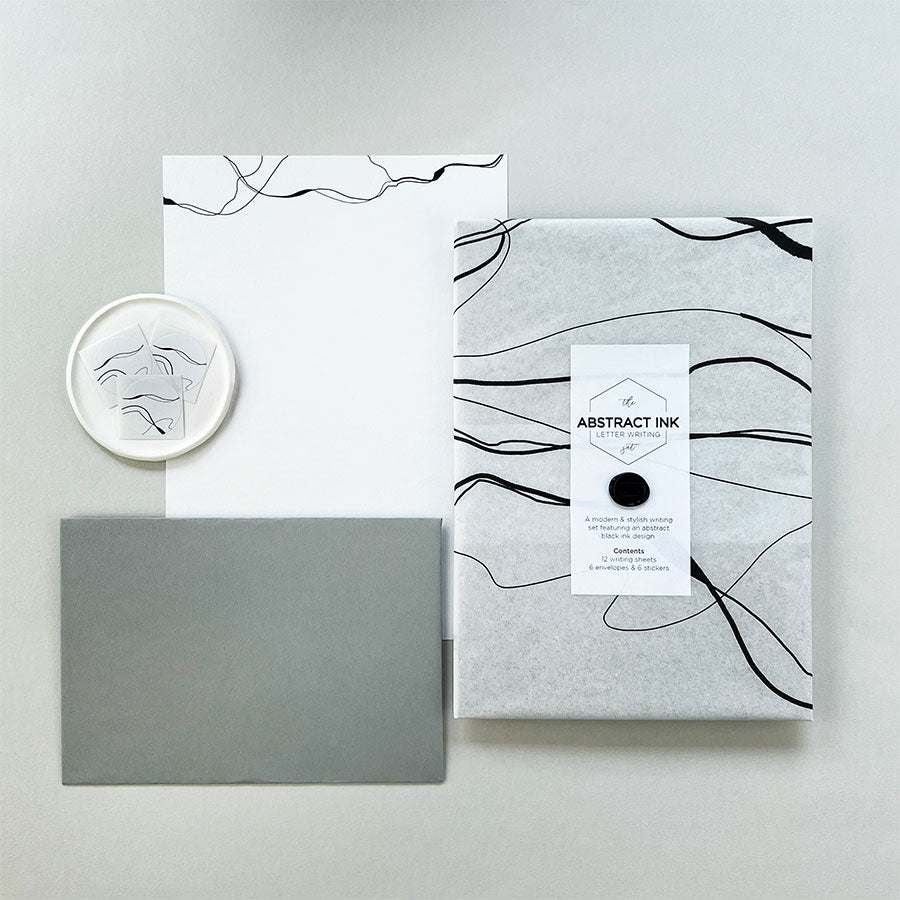 A luxury abstract ink letter writing set presented in our bespoke tissue paper & finished with a mini wax seal.