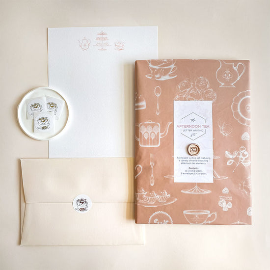 A luxury afternoon tea themed hand illustrated letter writing set presented in our bespoke tissue paper & finished with a mini wax seal.
