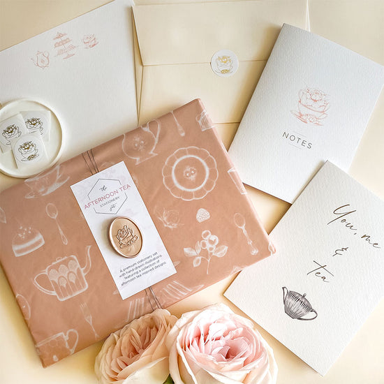 Afternoon tea stationery set, wrapped in illustrated tissue paper and finished with a handmade wax seal – a luxury themed gift.