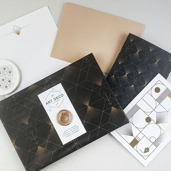 Load image into Gallery viewer, Art Deco stationery set, wrapped in illustrated tissue paper and finished with a handmade wax seal – a luxury themed gift.
