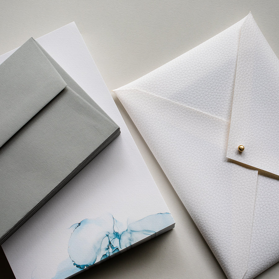Luxury alcohol ink design writing set, handmade white faux-leather envelope pouch, writing paper and envelopes. The Ethereal Collection Writing Set - a premium themed gift.