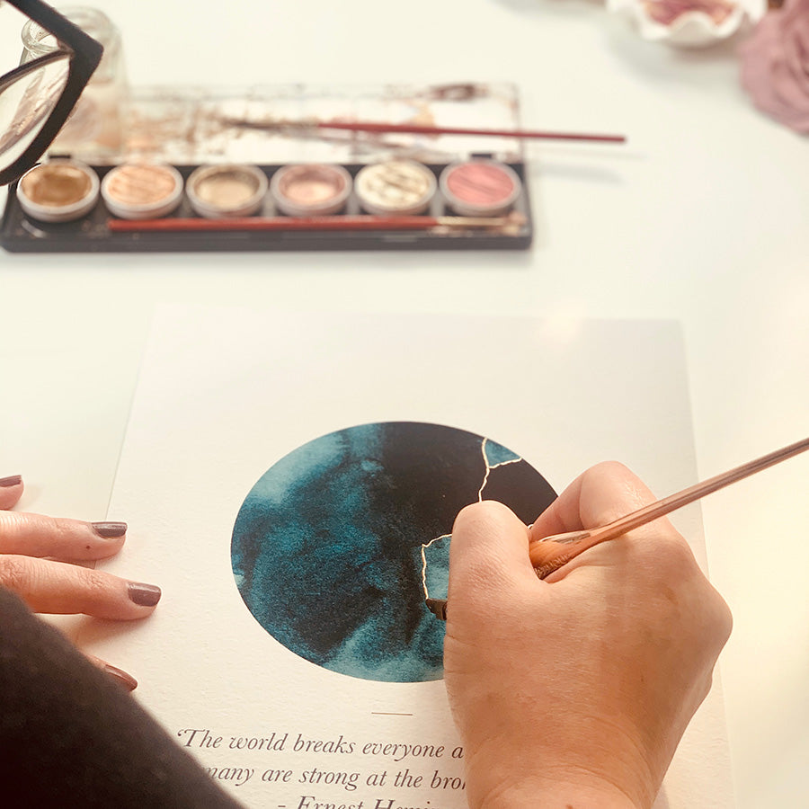 
                  
                    This A6 watercolour Kintsugi greeting card is printed at our studio & features an inky blue watercolour circle with hand-finished gold lines added.
                  
                