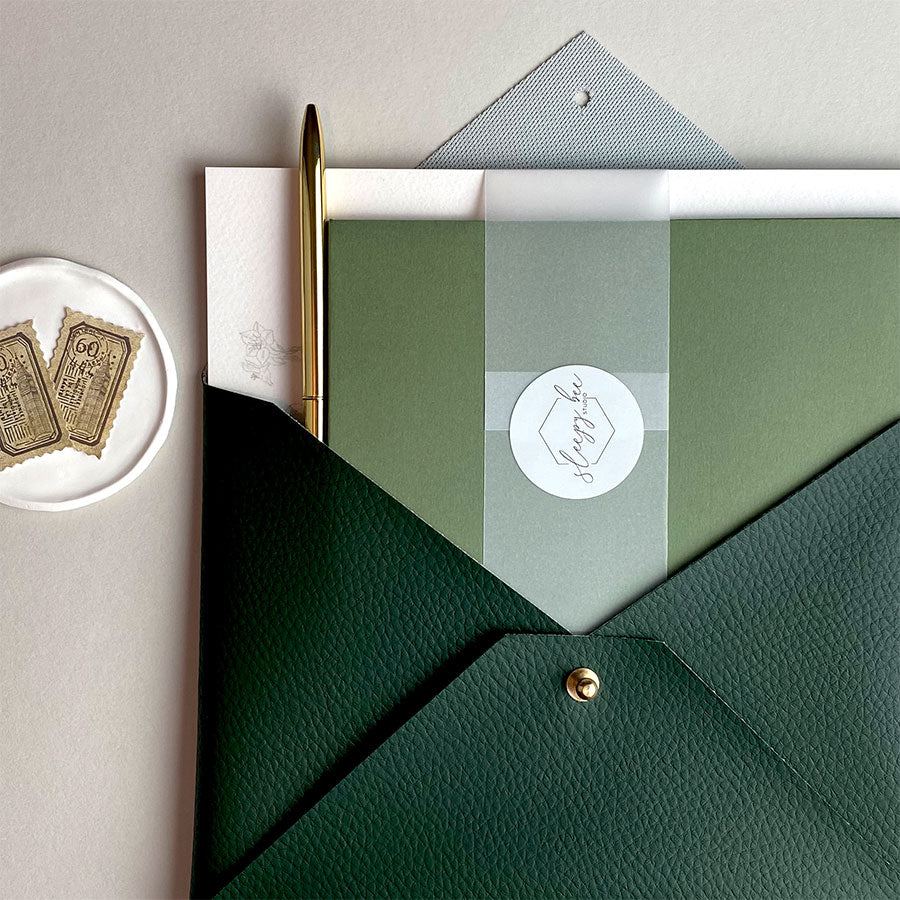 Luxury plant writing set, handmade dark green faux-leather envelope pouch and hand illustrated – writing paper and envelopes. The Botanical Collection Writing Set – a premium themed gift.