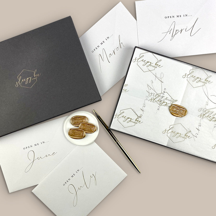 
                      
                        Year of letters box, a unique keepsake gift with luxury writing paper, envelopes, & gold foil stickers for you to write 12 letters.
                      
                    