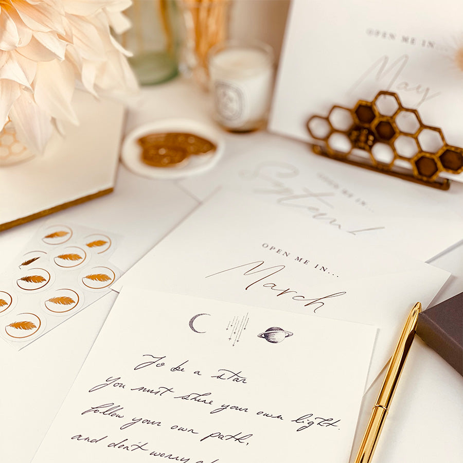 
                      
                        Year of letters box, a unique keepsake gift with luxury writing paper, envelopes, & gold foil stickers for you to write 12 letters.
                      
                    