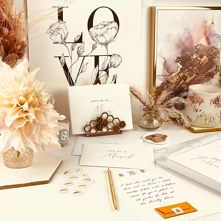 
                      
                        Year of letters box, a unique keepsake gift with luxury writing paper, envelopes, & gold foil stickers for you to write 12 letters.
                      
                    