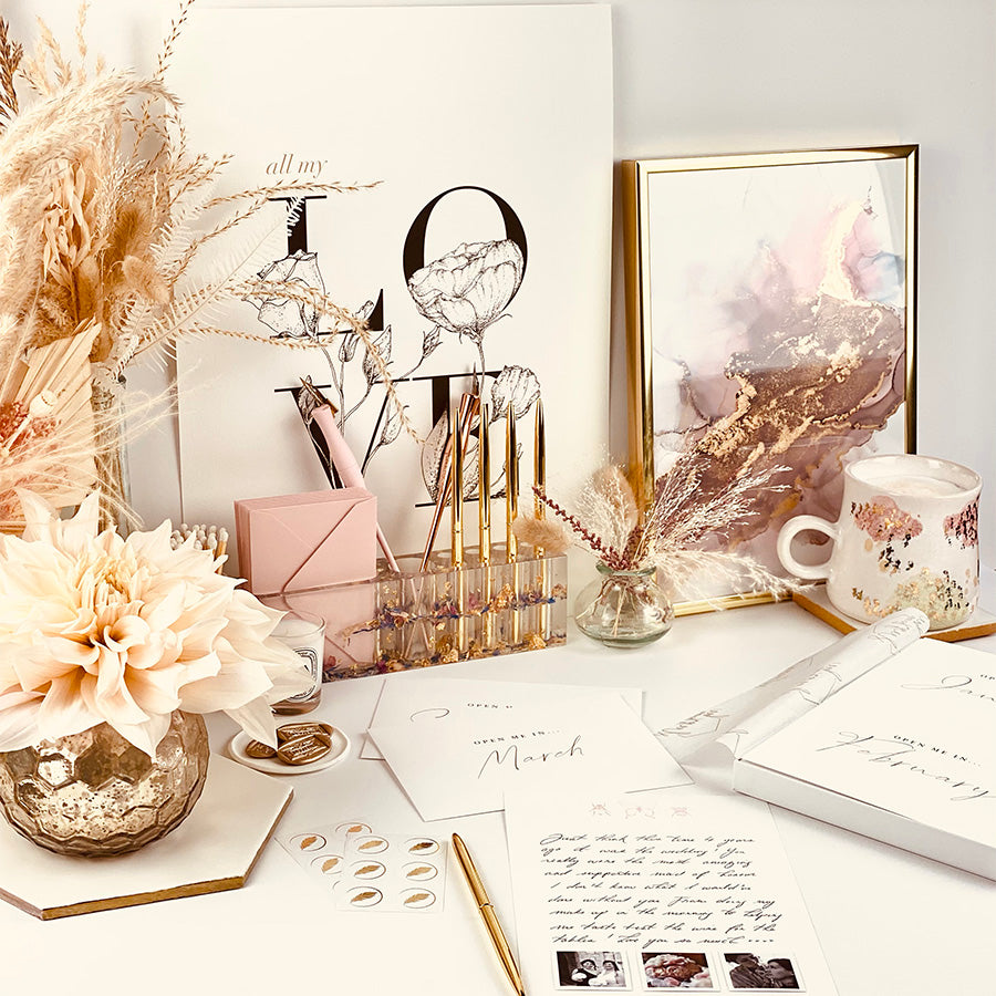 
                      
                        Year of letters box, a unique keepsake gift with luxury writing paper, envelopes, & gold foil stickers for you to write 12 letters.
                      
                    